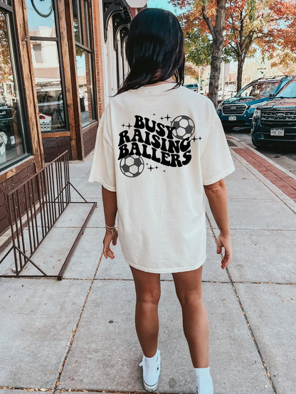 Busy Raising Ballers Soccer Graphic Tee